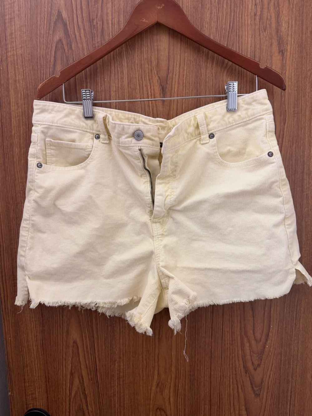 American Eagle Outfitters Women's Frayed High-Rise Shorts in Pale Yellow